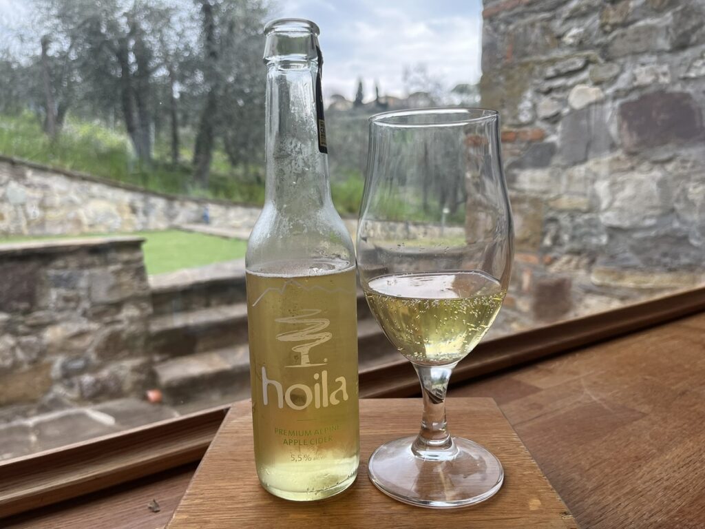 Hoila Cier bottle and cider in a stem glass