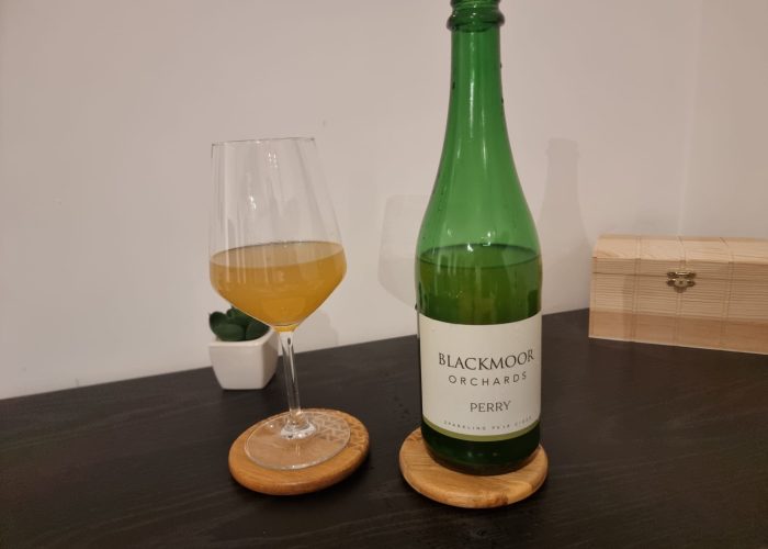 Blackmoor Orchards Perry 2022 - cider in glass with bottle