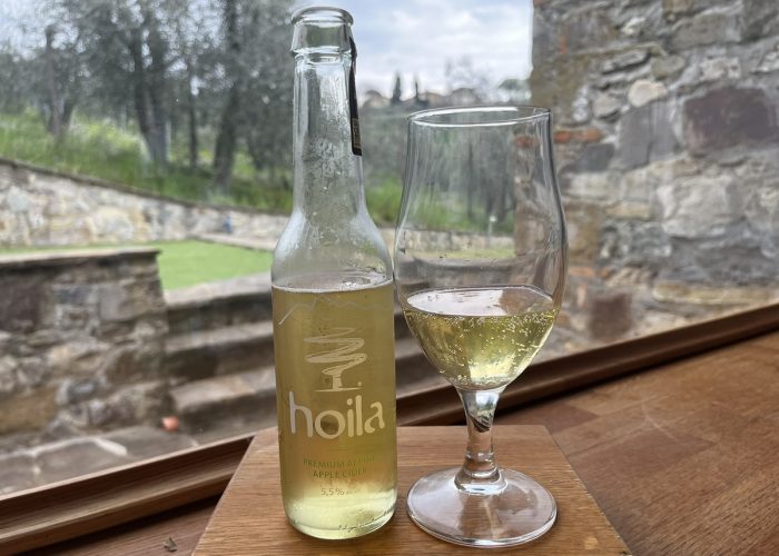 Hoila Cier bottle and cider in a stem glass